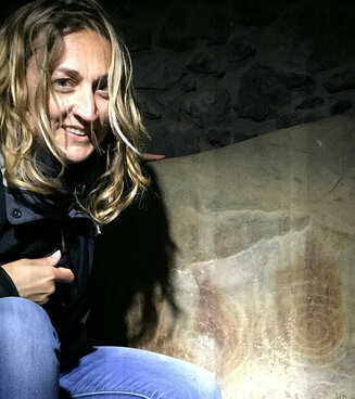 Carol James exploring cave art