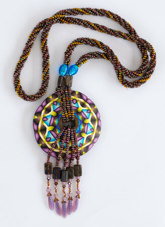 Beaded necklace with polymer clay focal piece