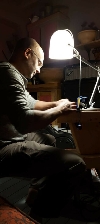 Jon hand sanding a blade