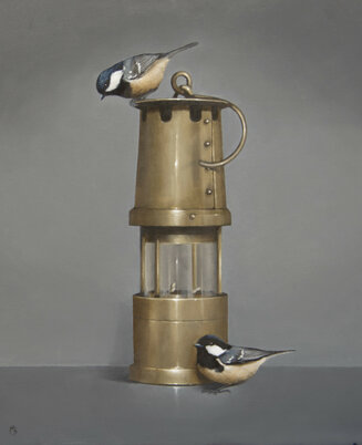 Coal tits on a miner's lamp
